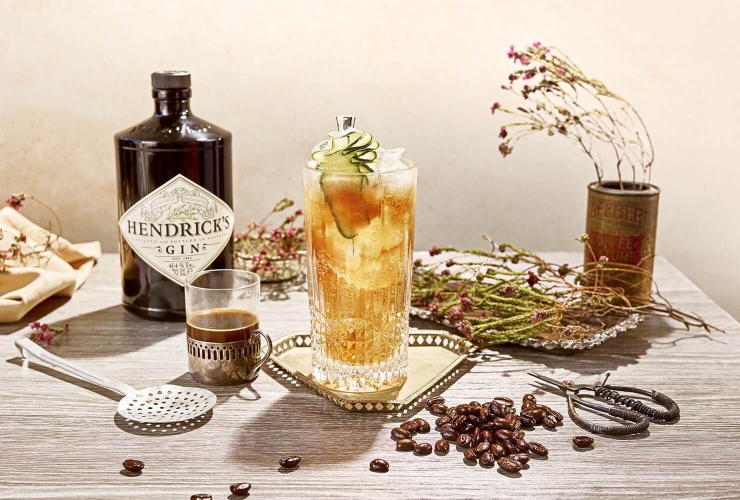 Coconut rum and gin cocktails garnished with cucumber and pineapple